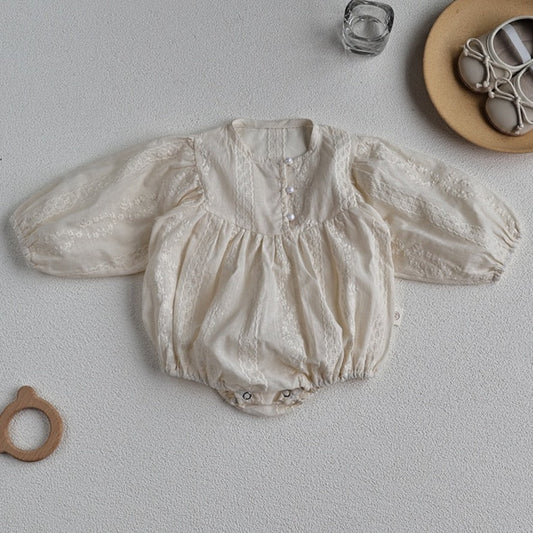 Girls vintage romper in cream colour with lace embellishment and buttons 