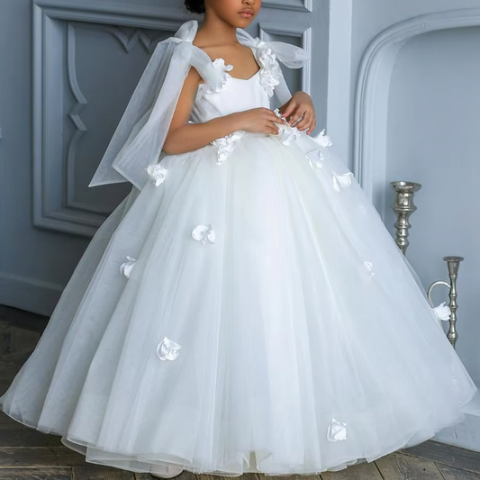 Flower girl princess dress in elegant white, adorned with delicate 3D flowers and a pearl necklace detail at the back. Features tie-up silk sleeves and a graceful low-back cut, perfect for a charming and sophisticated look.